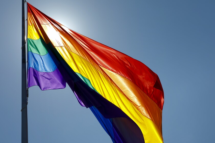 On the flag pole on the corner of University Avenue and Normal Street in Hillcrest, a large LGBT flag flag was flown.