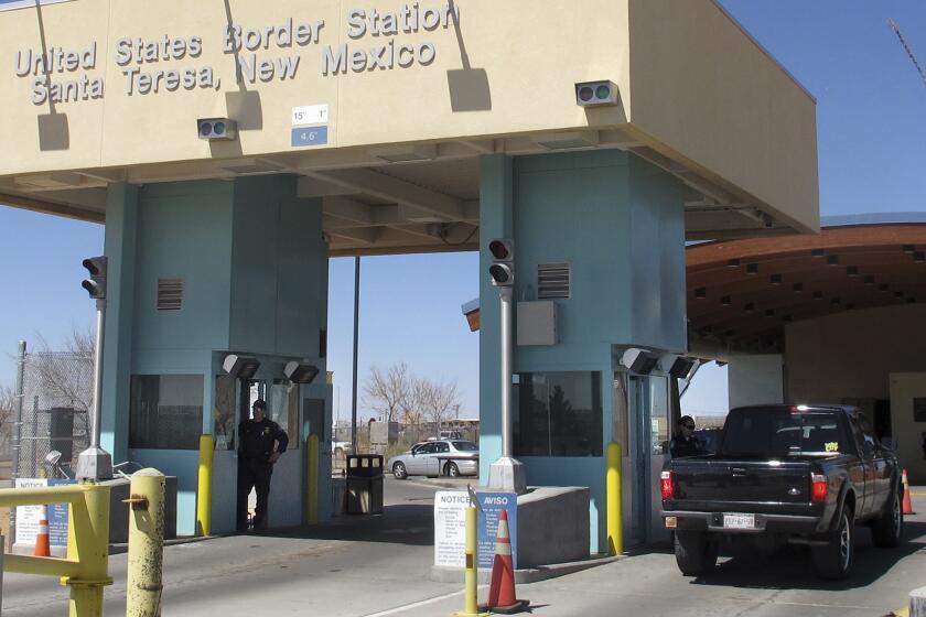 FILE - Traffic crosses from Mexico into the United States at a border station in Santa Teresa, N.M., in this photo made in March 14, 2012. The U.S. Border Patrol is asserting its right to seize cannabis shipments — including state-authorized commercial supplies — amid complaints of licensed cannabis providers that more than $300,000 worth of marijuana has been confiscated in recent months at Border Patrol highway checkpoints in southern New Mexico. (AP Photo/Jeri Clausing, File)