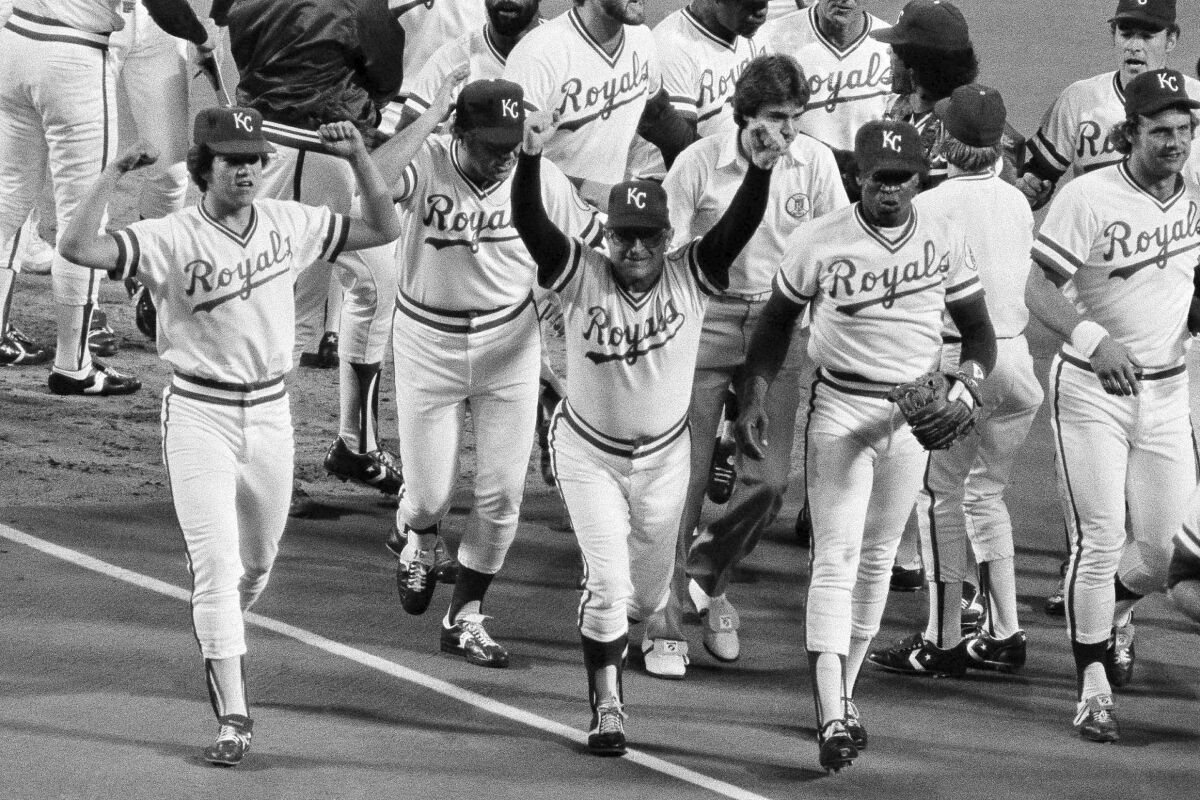 Kansas City manager Jim Frey, center, leads his players off the field after a 3-2 win over the New York Yankees in Game 2 of the 1980 American League Championship Series.