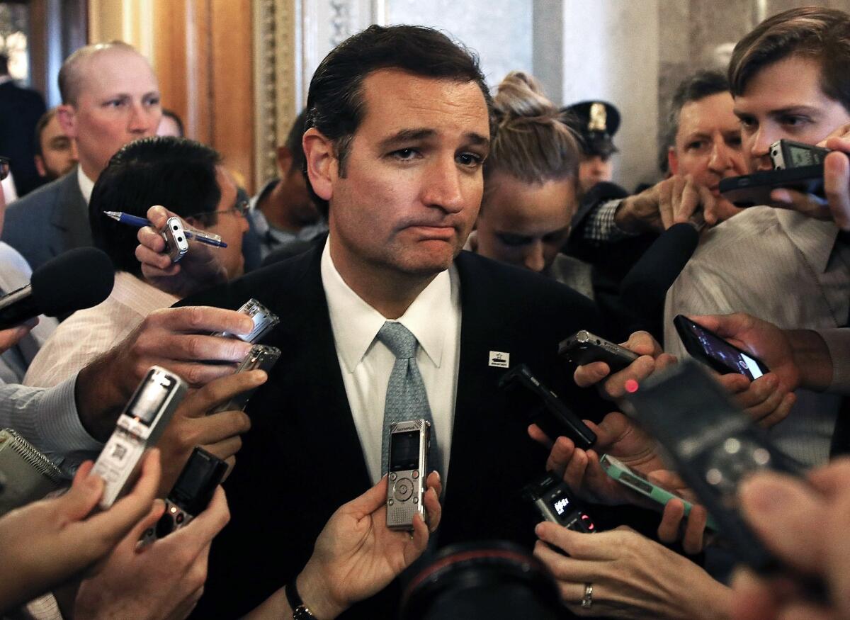 Sen. Ted Cruz (R-Texas) responds to reporters after speaking on the Senate floor for more than 21 hours in opposition to the Affordable Care Act in September 2013.