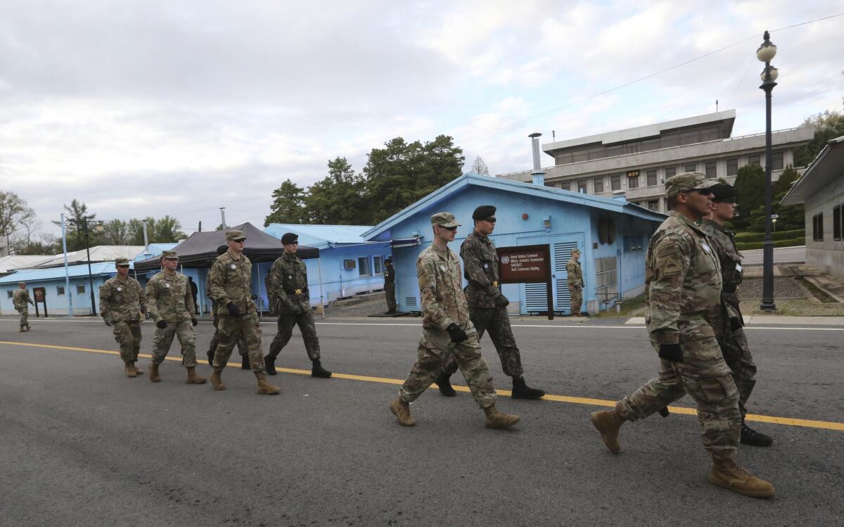 South Korean and U.S. Army soldiers, wearing grey uniforms