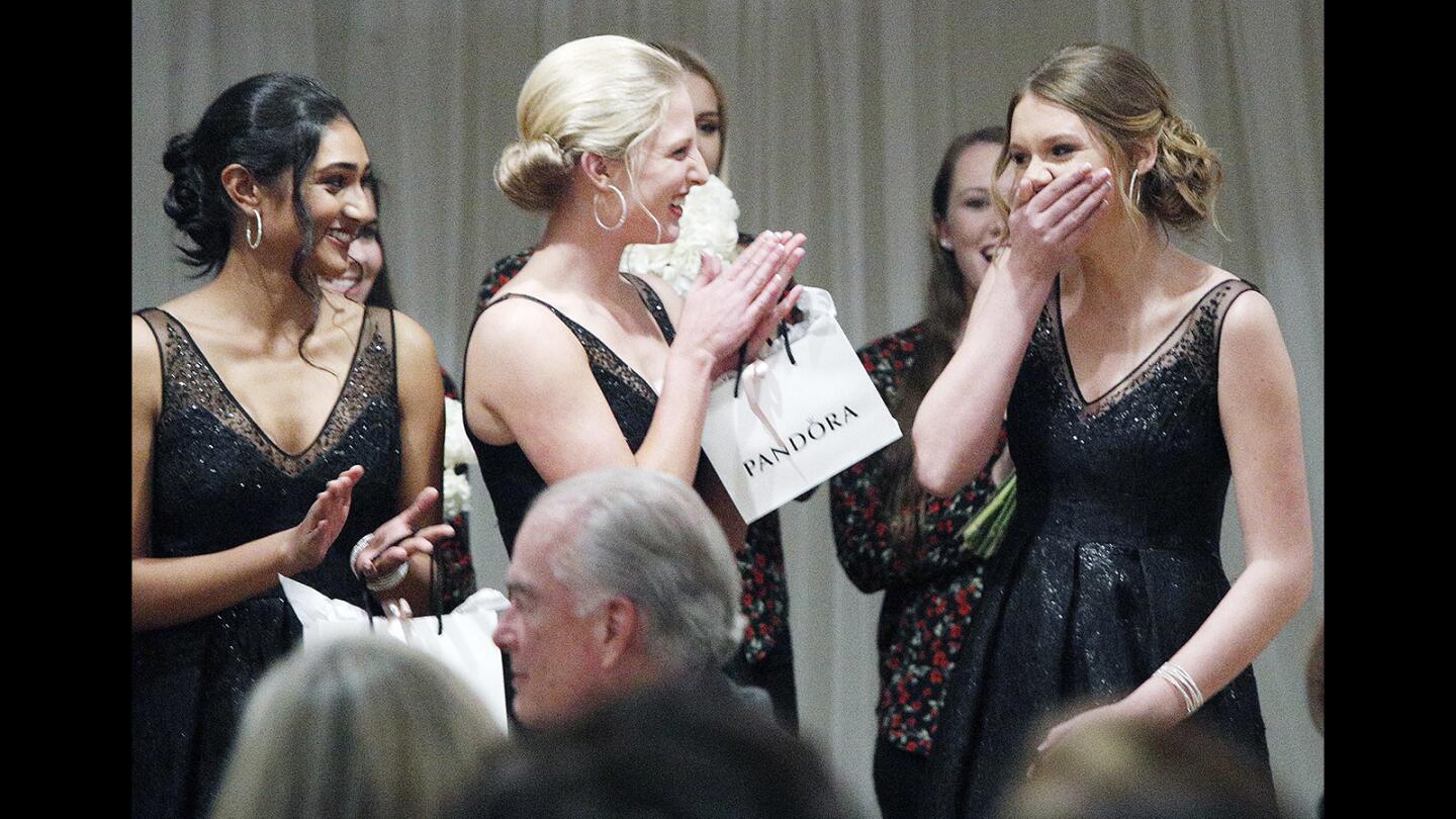 Hazel Valentine, right, puts her hand over her mouth after being named 2018 Miss La Canada Flintridge with support from Rucha Kadam and Julia Powers at the La Canada Flintridge Chamber of Commerce and Community Association 106th installation and awards gala at the La Canada Flintridge Country Club on Thursday, January 25, 2018. Miss La Canada Flintridge was coronated, business milestones were recognized, summer interns were honored, community service awards were given, and the new 2018 Chamber board and officers were announced.