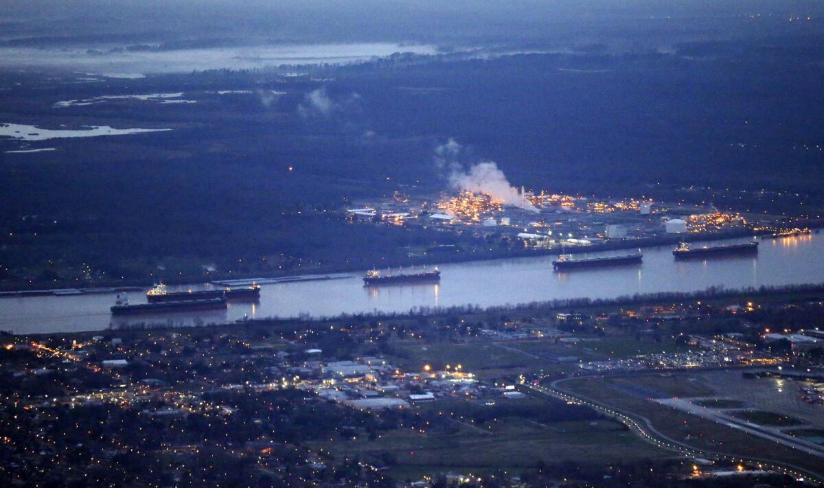 In this aerial photo, river traffic is halted along the Mississippi River in New Orleans, due to a barge leaking oil upriver in St. James Parish, La., on Feb. 23, 2014.