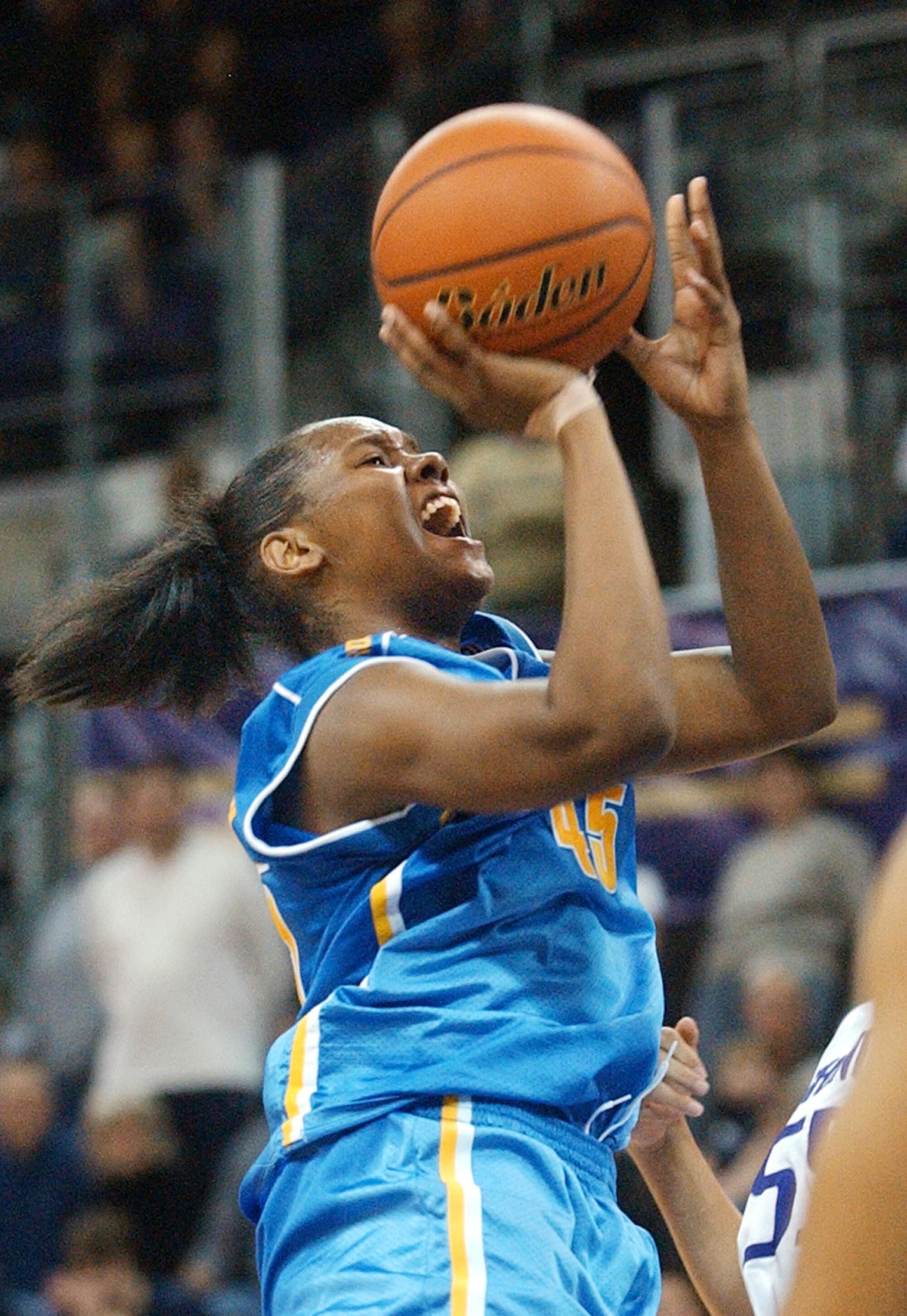 Noell Quinn drives for a layup while playing for UCLA in 2004.