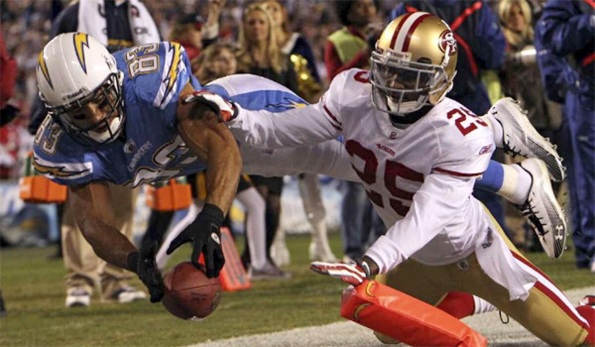 San Francisco 49ers cornerback Tarell Brown is unable to stop Chargers wide receiver Vincent Jackson from finding pay dirt on Dec. 16, 2010.