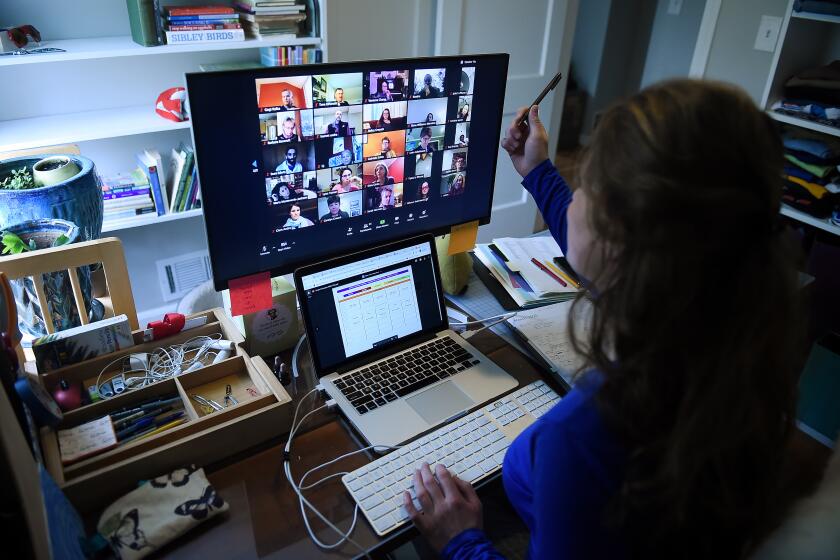 A lower school substitute teacher works from her home due to the Coronavirus outbreak on April 1, 2020 in Arlington, Virginia. - Her role in the school changed significantly when Coronavirus hit. She was previously working part time to support teachers when they needed to be absent from the classroom and now she helps them to build skills with new digital platforms so they can continue to teach in the best way for their students and their families.The middle school (grades 6-8) has most regularly been using Zoom and the lower grades have been using Zoom with parents. (Photo by Olivier DOULIERY / AFP) (Photo by OLIVIER DOULIERY/AFP via Getty Images)