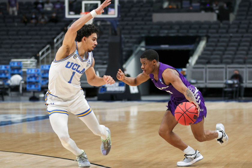 INDIANAPOLIS, INDIANA - MARCH 22: Damien Daniels #4 of the Abilene Christian Wildcats handles the ball.