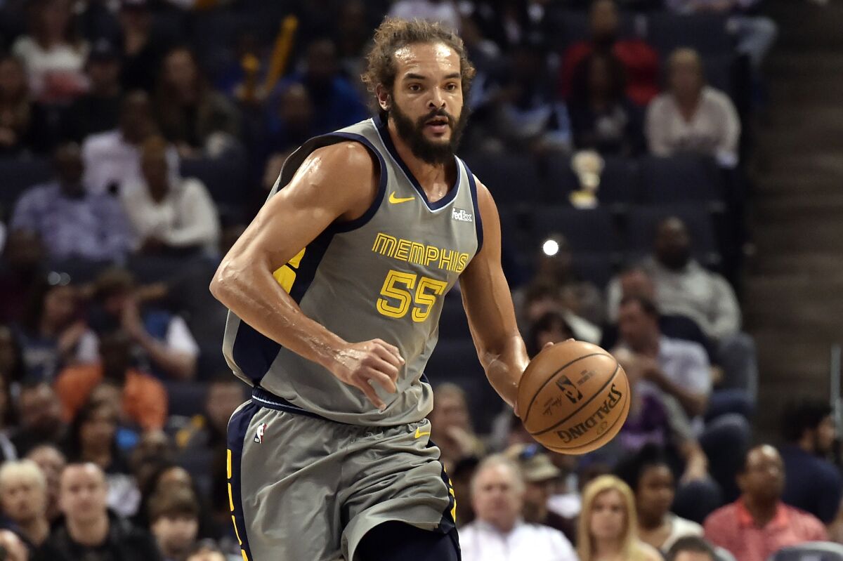 Memphis Grizzlies center Joakim Noah brings the ball up the court March 23, 2019.