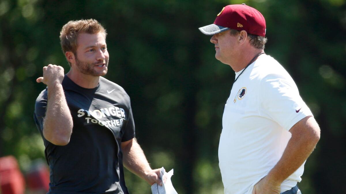 Then-Washington Redskins offensive coordinator Sean McVay, left, talks with coach Jay Gruden on June 8, 2016.