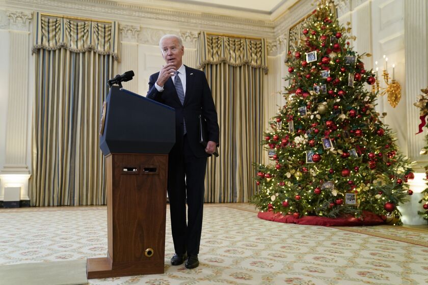 President Joe Biden answers a reporters question after delivering remarks on the November jobs report, in the State Dining Room of the White House, Friday, Dec. 3, 2021, in Washington. (AP Photo/Evan Vucci)