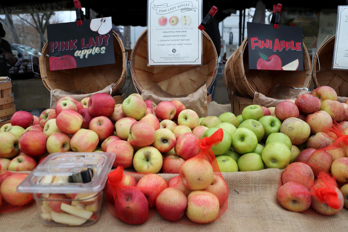Fresh apples by Sunny Cal farms for sale at the Irvine Regional Park Farmers Market in Orange.