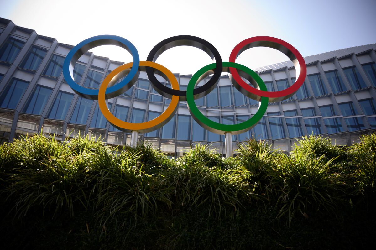 The Olympic logo in front of a building