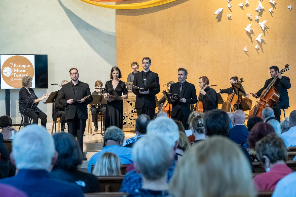 Performers sing alongside an orchestra for the 43rd Baroque Music Festival in Newport Beach last year.