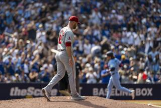 TORONTO, CANADA - AUGUST 25: Hunter Strickland #61 of the Los Angeles Angels stands on the mound as Addison Barger #47 of the Toronto Blue Jays rounds third base after hitting a home run during the sixth inning at Rogers Centre on August 25, 2024 in Toronto, Canada. (Photo by Kevin Sousa/Getty Images)