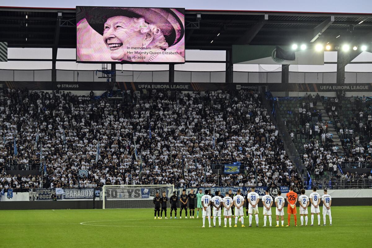 The stadium during a minute of silence after the passing of Britain's Queen Elizabeth II during the Europa League Group A soccer match between FC Zuerich and Arsenal, Thursday, Sept. 8, 2022, at the Kybunpark stadium, in St. Gallen, Switzerland. (Gian Ehrenzeller/Keystone via AP)