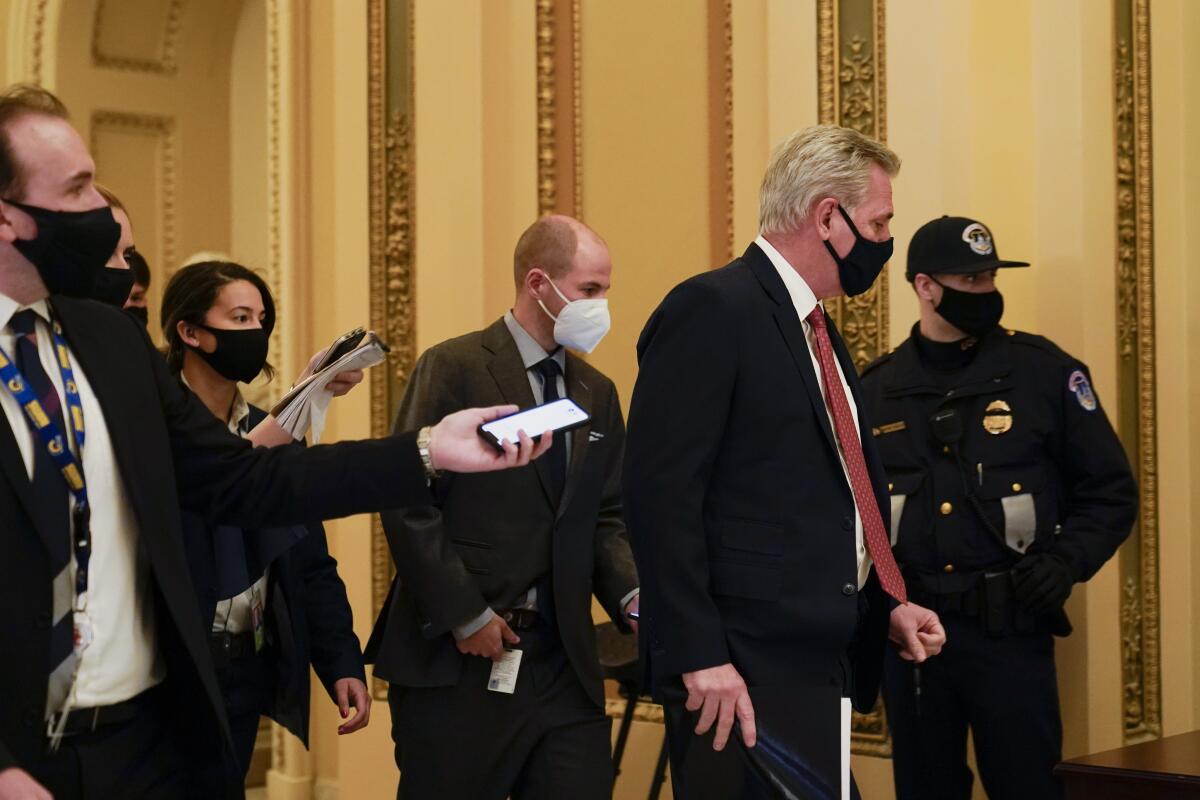 House Minority leader Kevin McCarthy heads to the House chamber