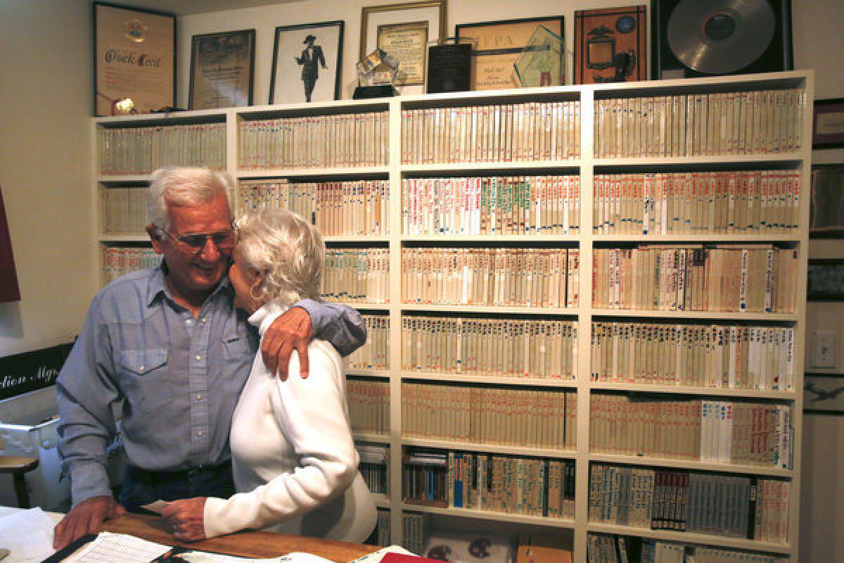 After working in his recording studio, deejay Chuck Cecil gets a hug from Edna, his wife of 66 years.