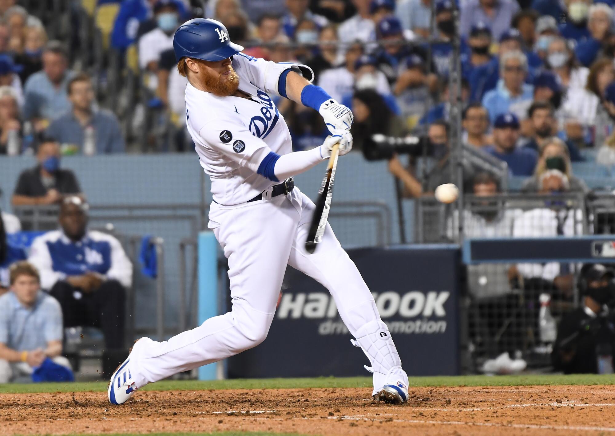 Los Angeles Dodgers' Justin Turner hits a solo home run to tie the game