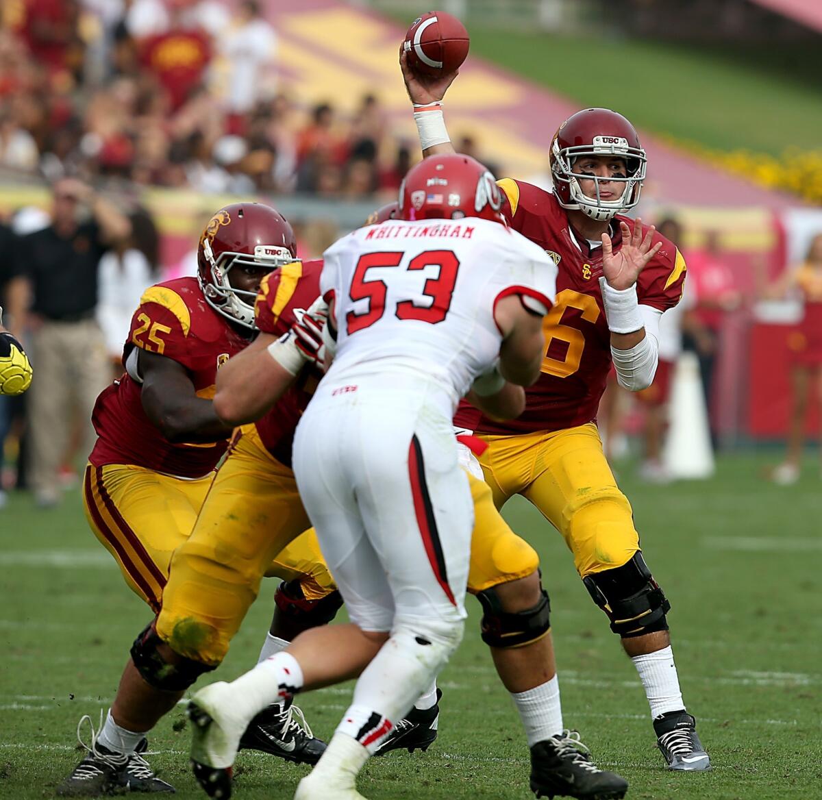 USC quarterback Cody Kessler is protected by his offensive line as he makes a pass during a 19-3 win over Utah.