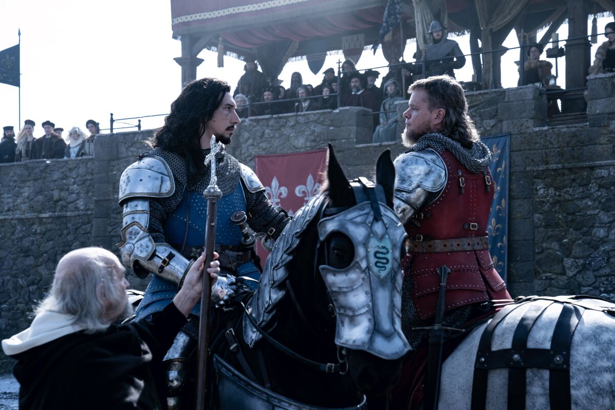 Adam Driver and Matt Damon don 14th century armor as they prepare to duel in a scene from “The Last Duel.”