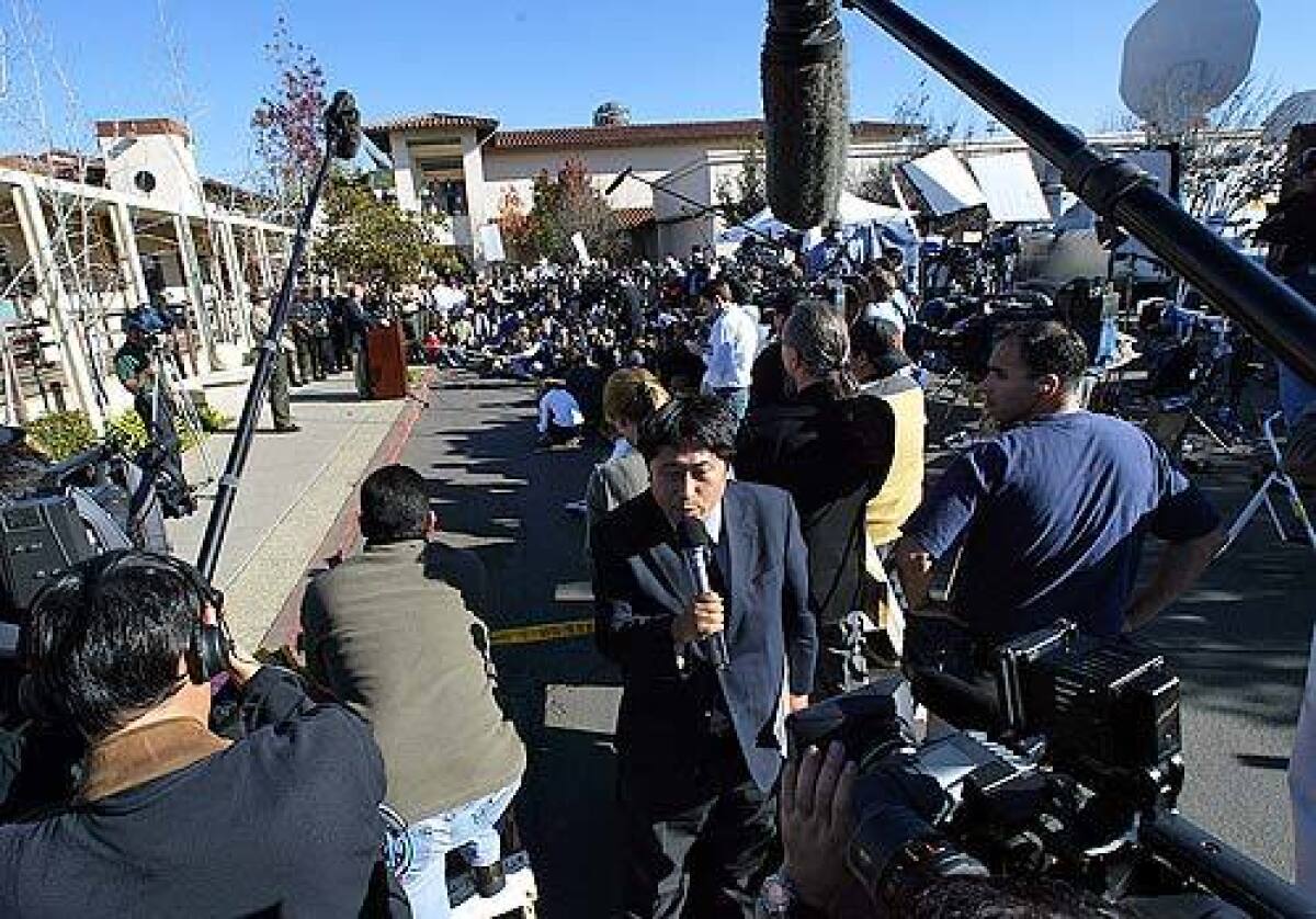 Press gather at the Santa Maria courthouse in 2003 when Santa Barbara County District Attorney Tom Sneddon faced journailsts after filing charges of child molestation against Michael Jackson.
