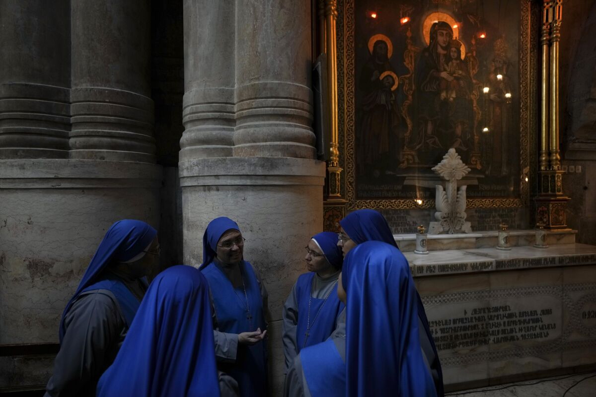 Nuns gather at the Church of the Holy Sepulchre during a Good Friday procession in Jerusalem on April 15.