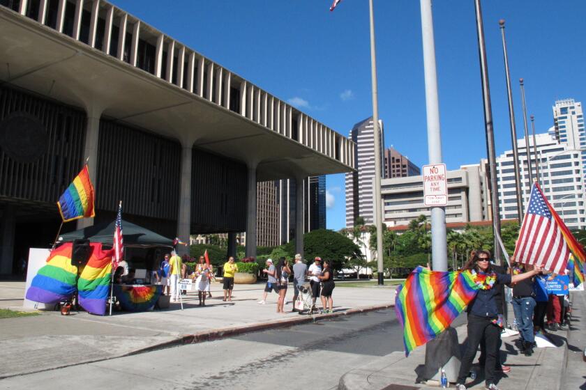 Gay marriage supporters rally outside the Hawaii Capitol in Honolulu on Tuesday, the day the Senate voted to approve same-sex marriage.