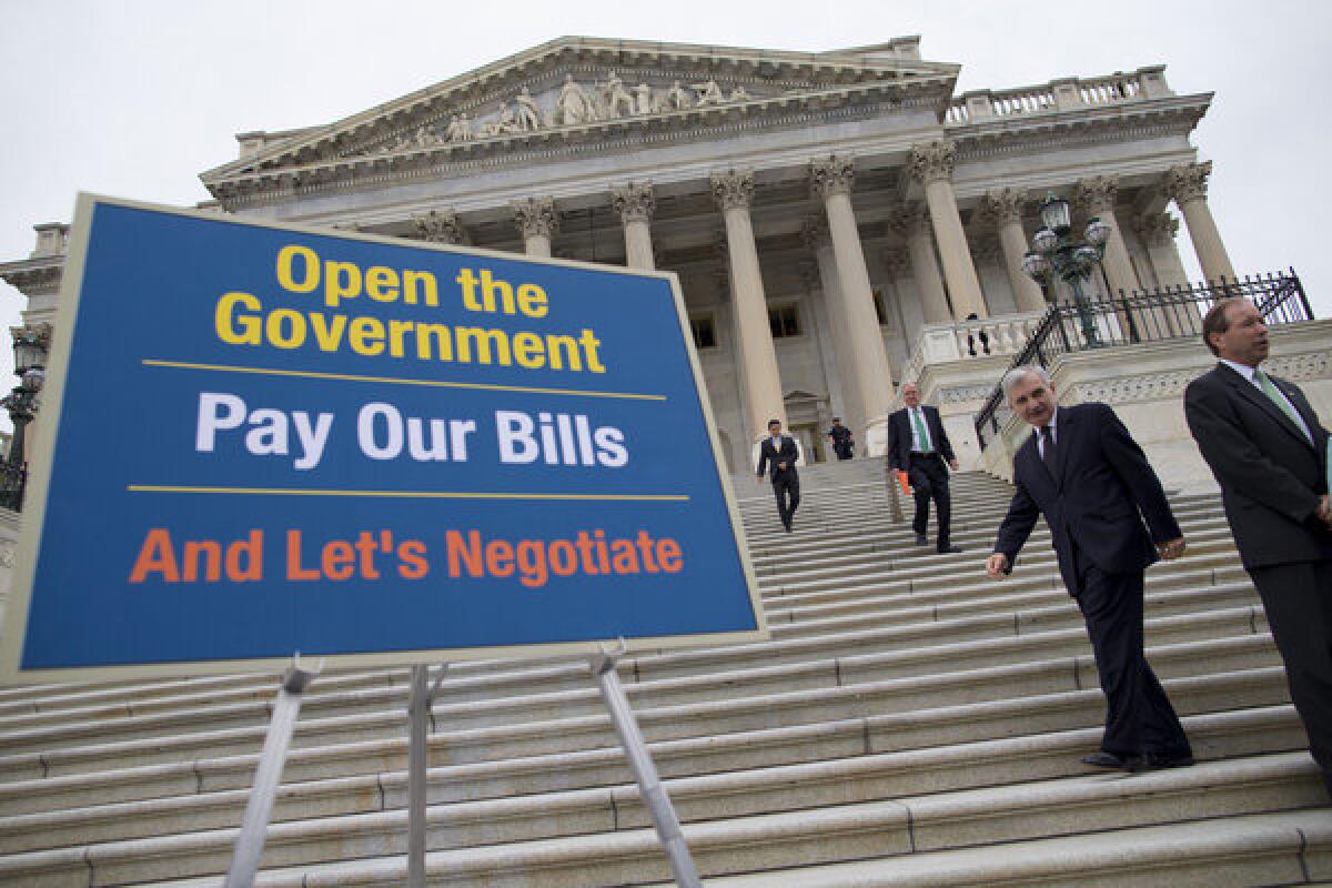 Lawmakers arrive for a news conference on the ongoing budget battle Wednesday in Washington.