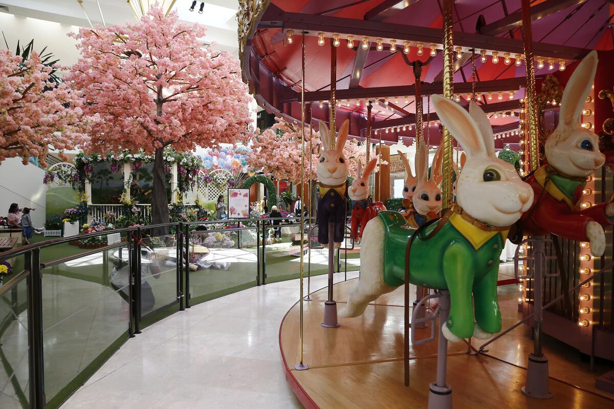 A bunny carousel is part of "Springtime Gardens" at South Coast Plaza in Costa Mesa.