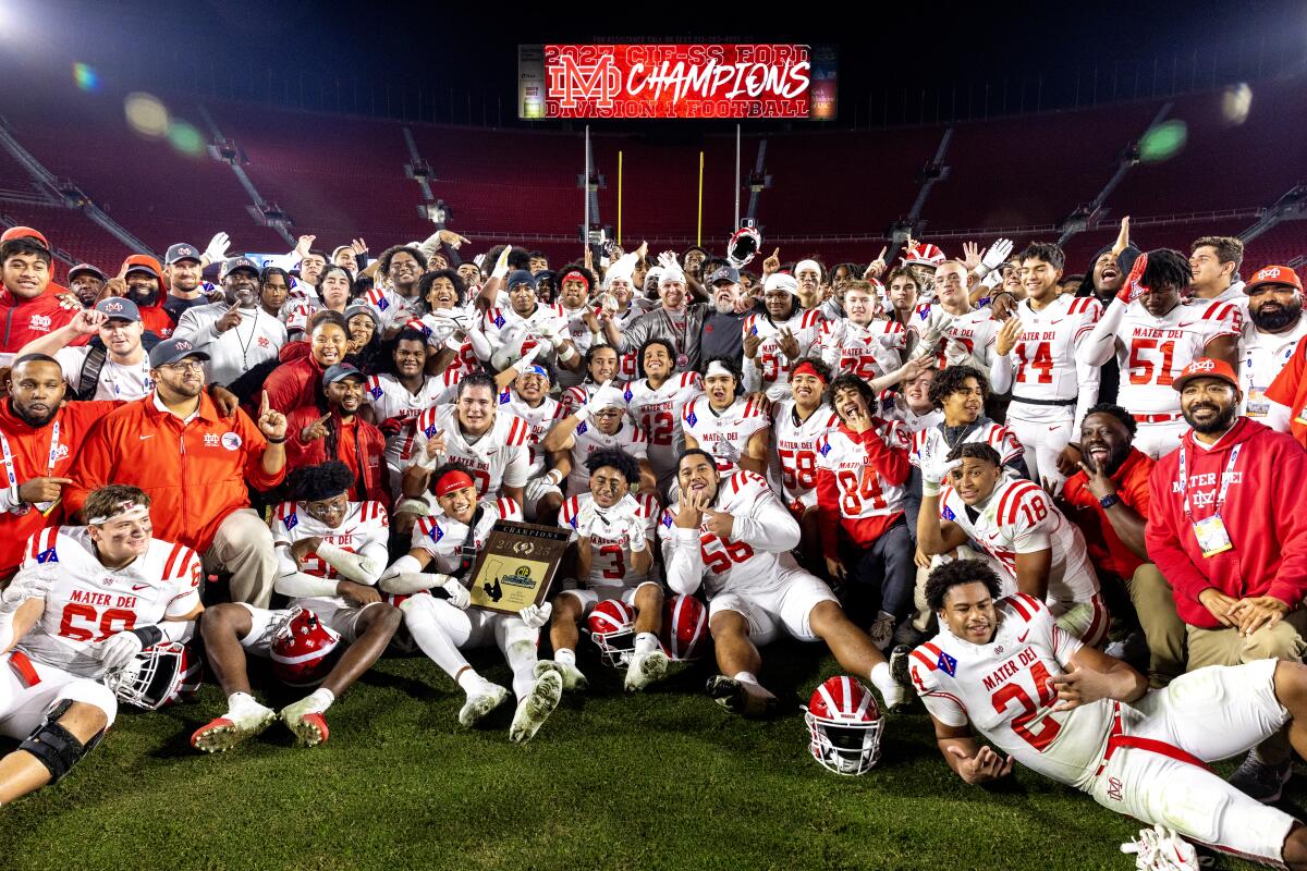 The Mater Dei High football team poses for a photo after winning the Southern Section Division 1 title.