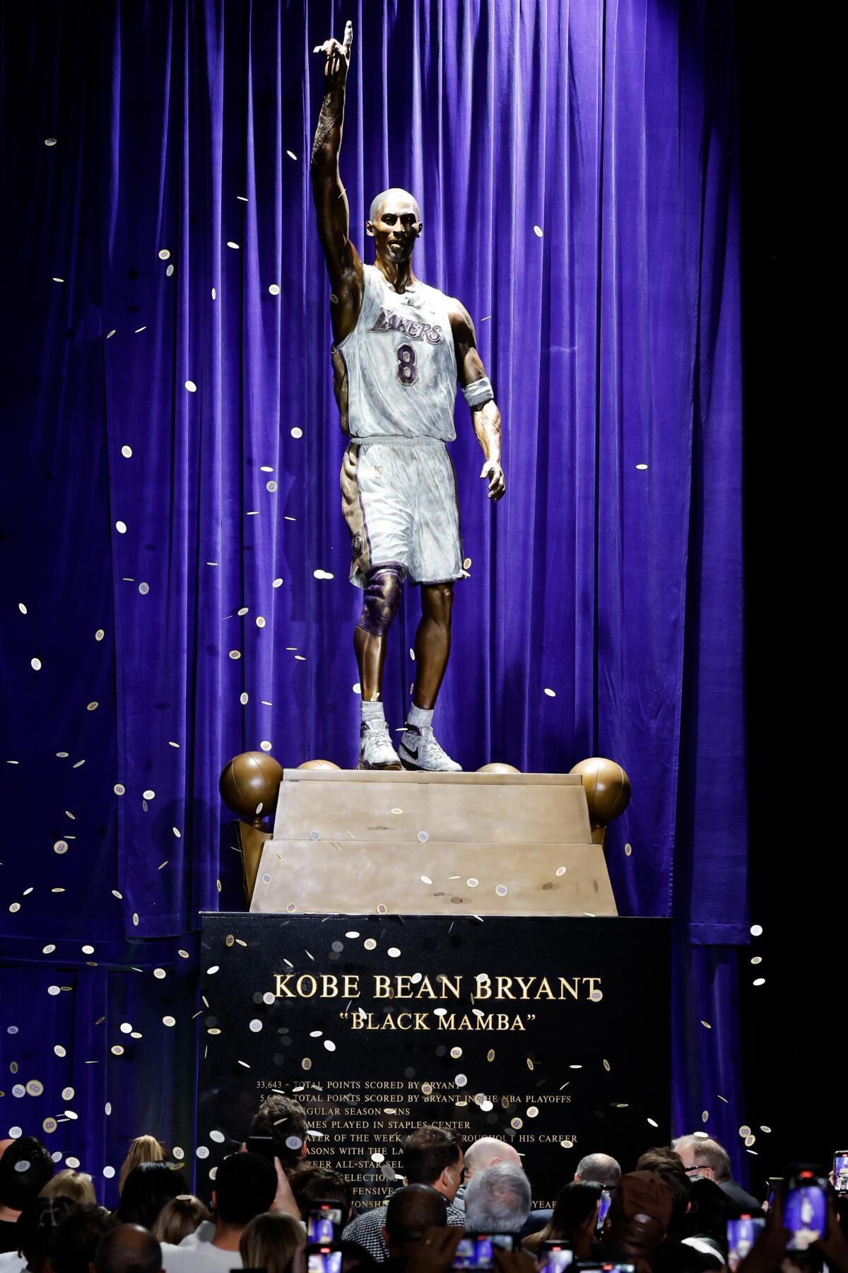 A 19-foot, 4,000-pound bronze statue of Lakers legend Kobe Bryant is unveiled during a ceremony outside Crypto.com Arena.