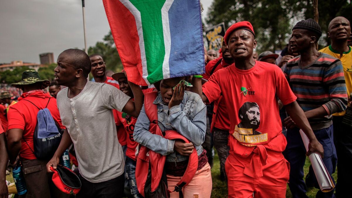 Members of the opposition Economic Freedom Fighters party at a protest calling for the resignation of President Jacob Zuma last month. (Gianluigi Guercia / AFP/Getty Images)
