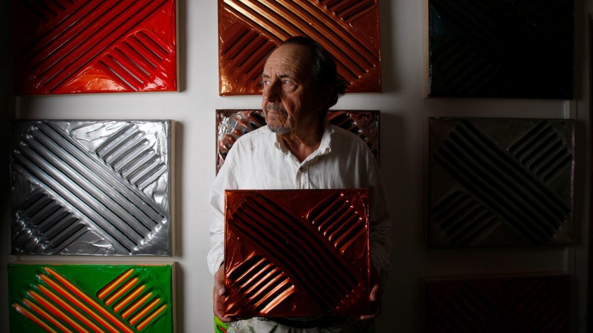 Albert Contreras, shown in his home in 2009, had quit painting in the '70s and drove trash trucks in Santa Monica. In 1997, he returned to painting. Contreras died June 17 at age 84.