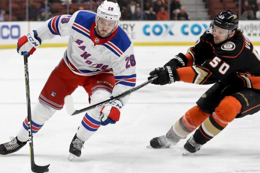 New York Rangers center Paul Carey vies for the puck with Anaheim Ducks center Antoine Vermette during the first period of an NHL hockey game in Anaheim, Calif., Tuesday, Jan. 23, 2018. (AP Photo/Chris Carlson)