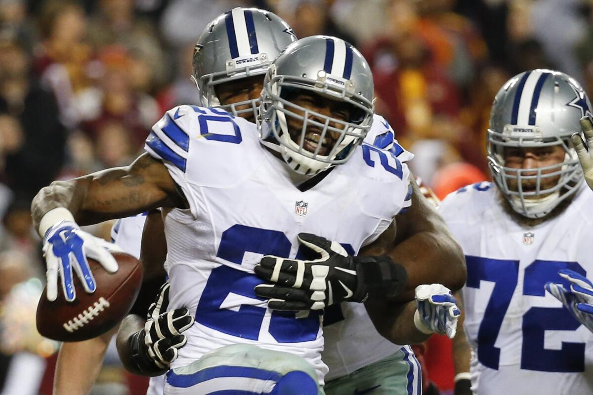 Cowboys running back Darren McFadden (20) celebrates his touchdown during the second half against the Redskins.