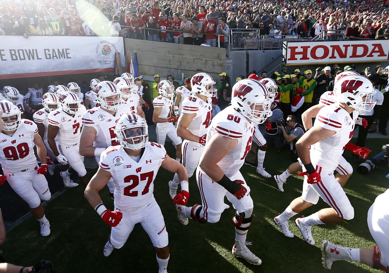 Wisconsin takes the field before the start of the Rose Bowl Game against Oregon.