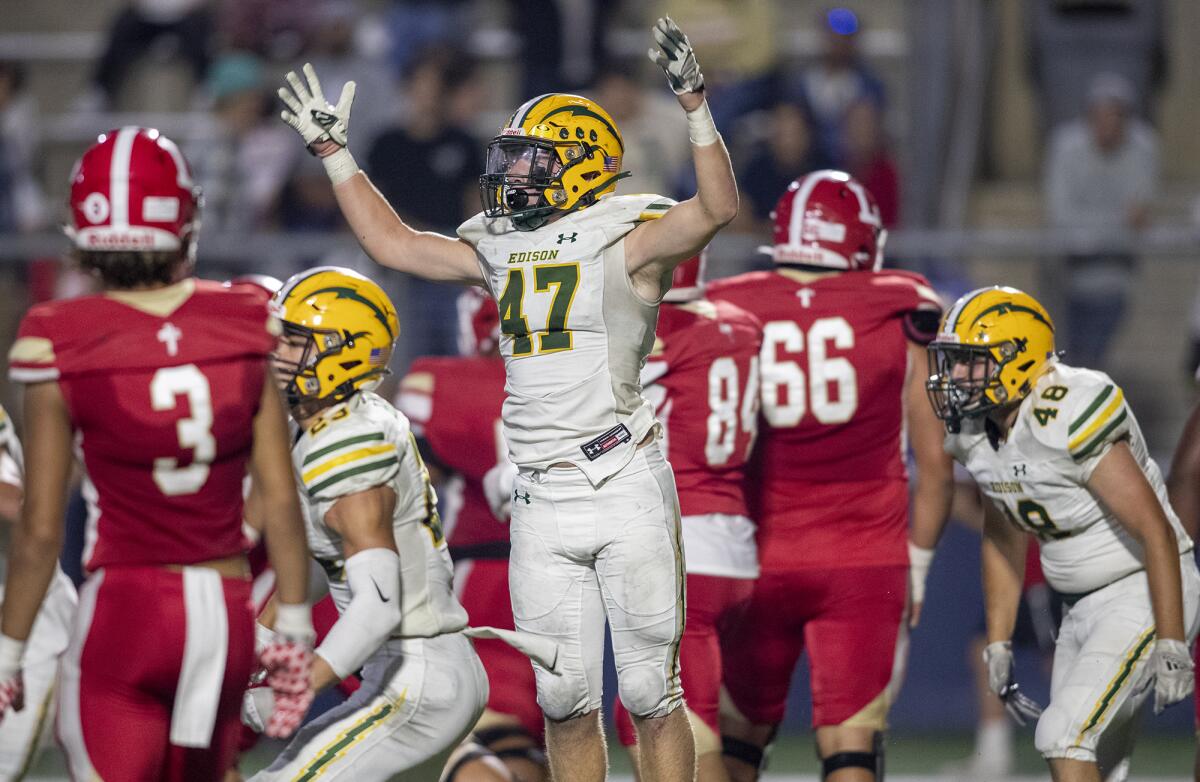 Edison's Hudson Letterman celebrates an Orange Lutheran turnover in the red zone during a nonleague game on Sept. 3.