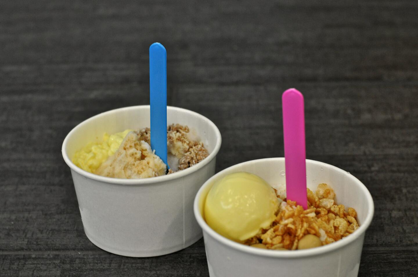 Two of Ice Que's "oma-QUE-se" offerings: the Horchata and the Milk & Honey shave ice cups.