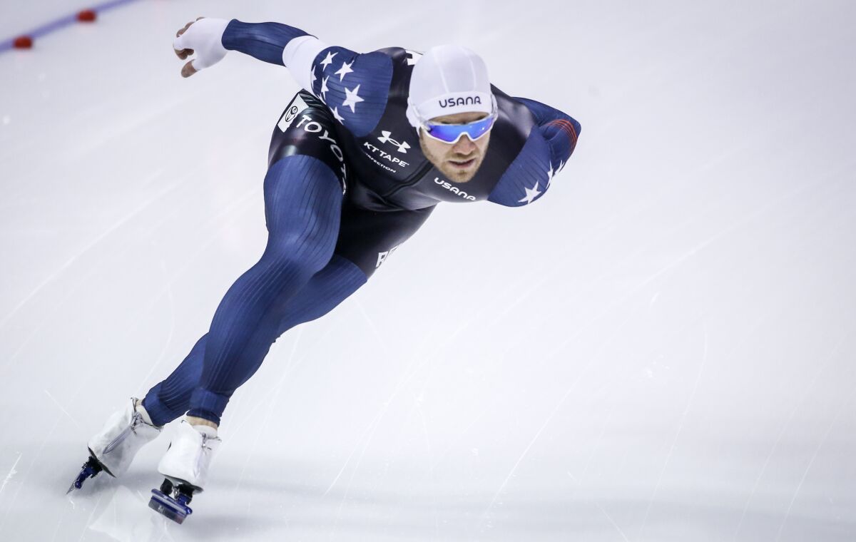 Joey Mantia, of the United States, skates during the men's 1500-meter competition at the ISU World Cup speed skating event in Calgary, Alberta, Saturday, Dec. 11, 2021. (Jeff McIntosh/The Canadian Press via AP)