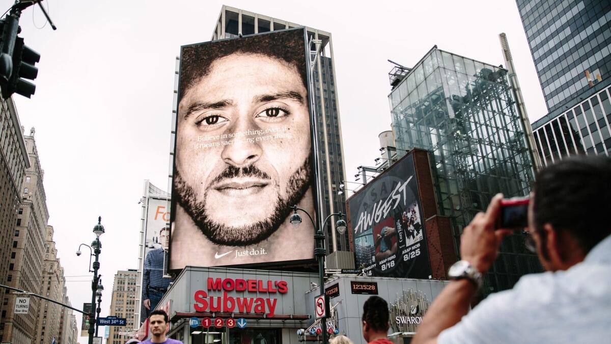 A new Nike ad campaign billboard featuring NFL quarterback Colin Kaepernick can be seen in midtown Manhattan, in New York on September 7.
