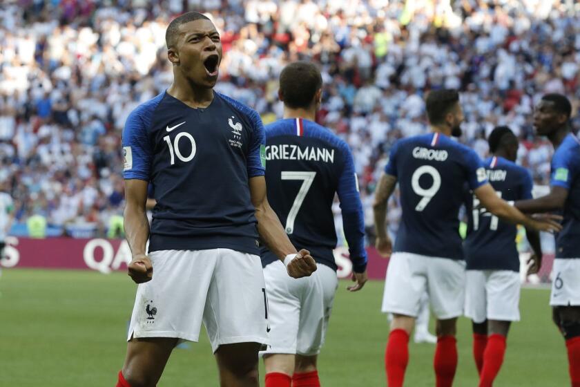 FILE - In this Saturday, June 30, 2018 file photo, France's Kylian Mbappe celebrates after scoring his side's third goal during their round of 16 match against Argentina, at the 2018 soccer World Cup at the Kazan Arena in Kazan, Russia. Kylian Mbappe and Thierry Henry are seemingly linked by destiny. While Henry is France's leading scorer with 51 goals and among the greatest forwards of the modern era, the 19-year-old Mbappe is the new French sensation tipped to become perhaps even the world's best. (AP Photo/David Vincent, file)