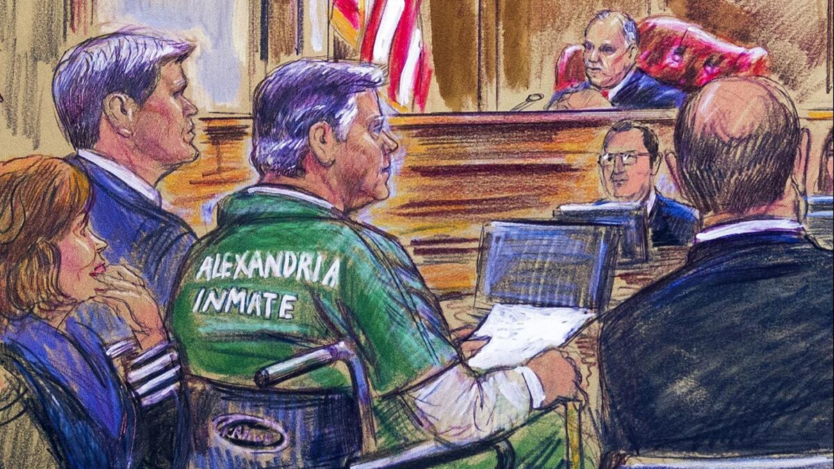 This courtroom sketch depicts former Trump campaign chairman Paul Manafort, center in a wheelchair, during his sentencing hearing in federal court before Judge T.S. Ellis III in Alexandria, Va., on March 7.