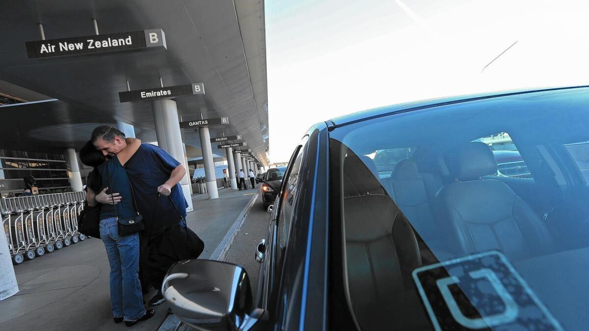 An Uber driver drops off a passenger at Los Angeles International Airport.