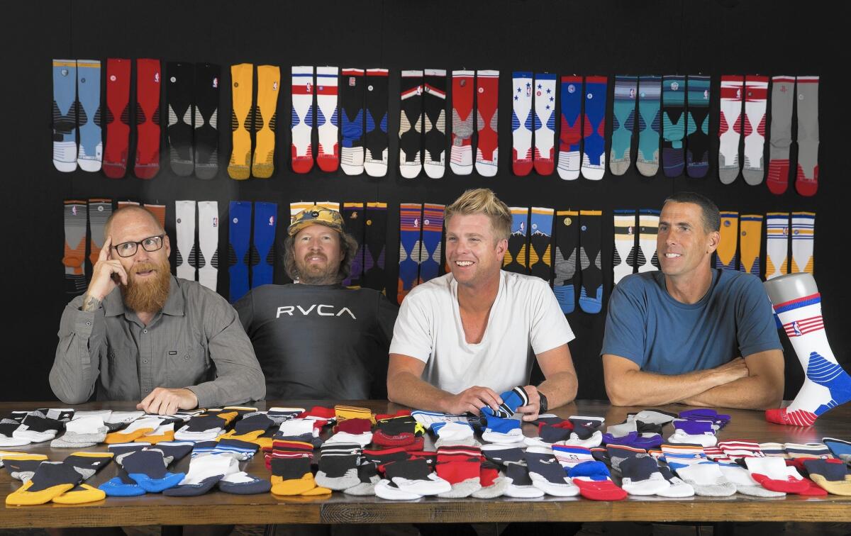 Ryan Kingman, left, Jeff Kearl, Aaron Hennings and John Wilson are four of Stance's five co-founders. (Not shown is Taylor Shupe.) The privately held company expects to sell 12 million pairs of socks in 2015. It makes the NBA's official on-court socks for the 2015-2016 season.