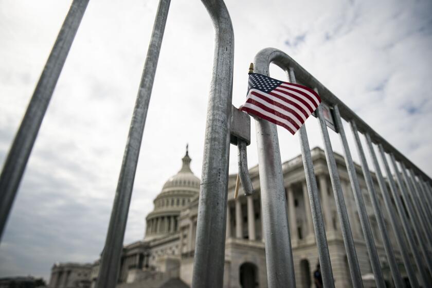An American flag is placed on a fence outside of the U.S. Capitol building on September 28, 2020 in Washington, DC.