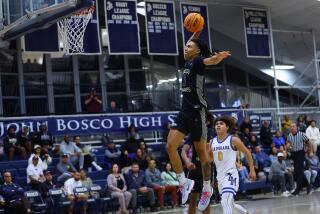 Elzie Harrington of St. John Bosco heads for a dunk against La Mirada.