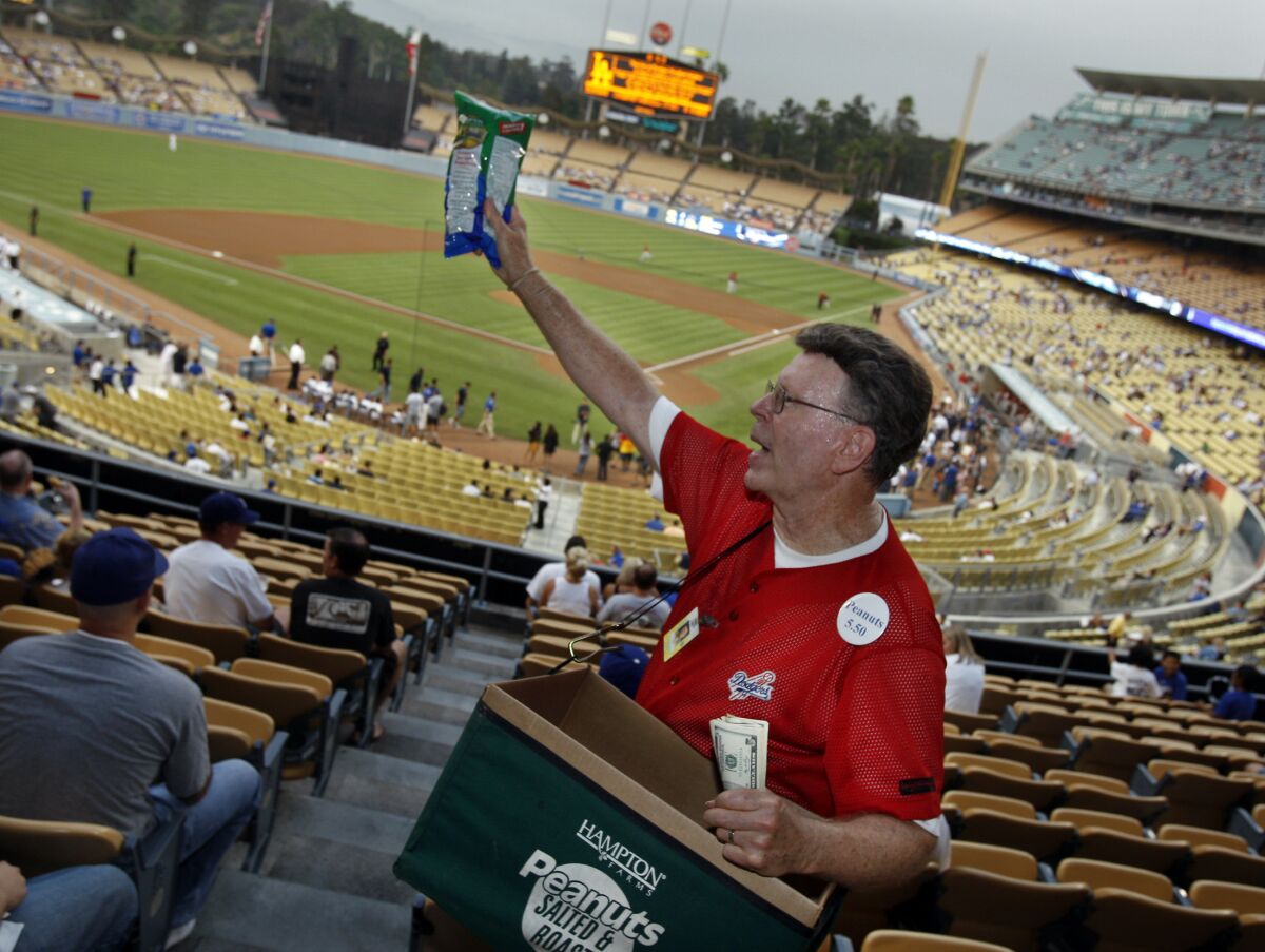 Roger Owens has been a peanut vendor at Dodger Stadium for 50 years. (FILE PHOTO: Christine Cotter/Los Angeles Times)