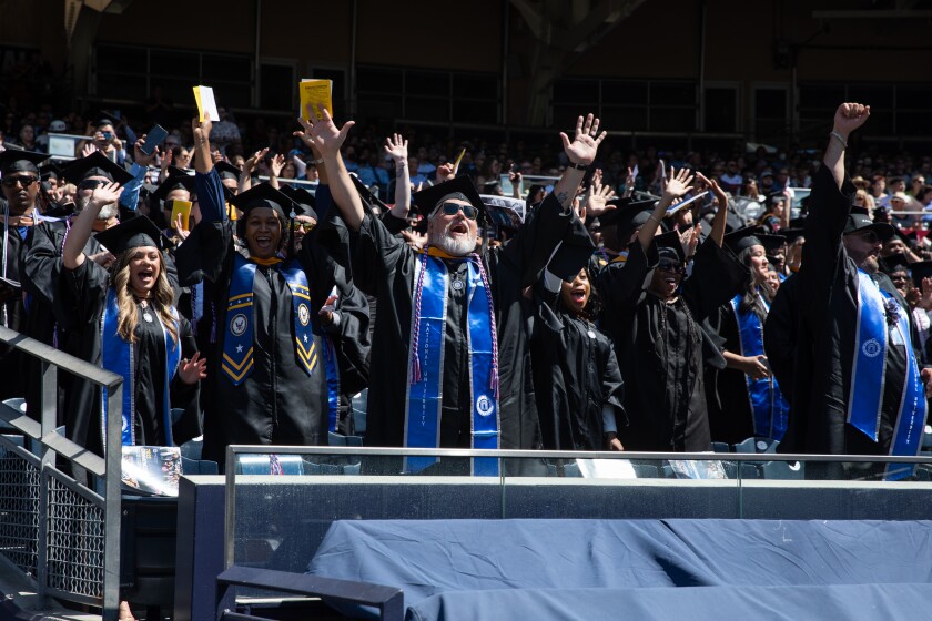 National University students participate in the Class of 2022 commencement at Petco Park.