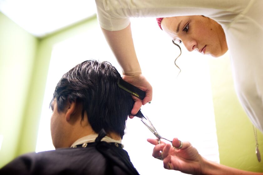 A Marinello Schools of Beauty student cuts hair in Provo, Utah, in 2010.