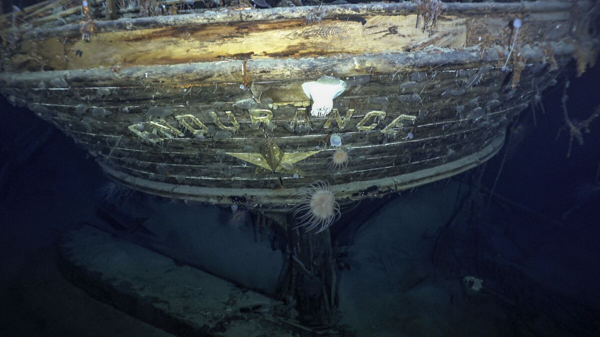 The stern of a submerged shipwreck with the word 'ENDURANCE' across it